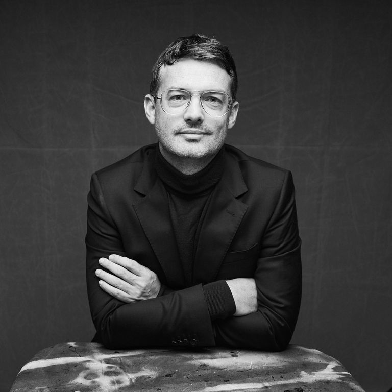 Black and white portrait of Kevin van der Zwaag wearing glasses, a turtleneck, and a blazer.